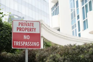 A 'Private Property' sign stands boldly, representing the essential understanding of Florida's Stand Your Ground Law at its core.