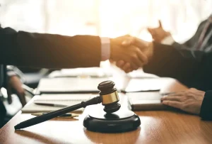 A snapshot of an attorney shaking hands with a client, symbolizing case studies related to Florida Statute 790.23.